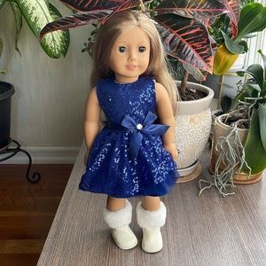 American Girl 18” Doll dressed in Christmas party outfit: dress and boots.